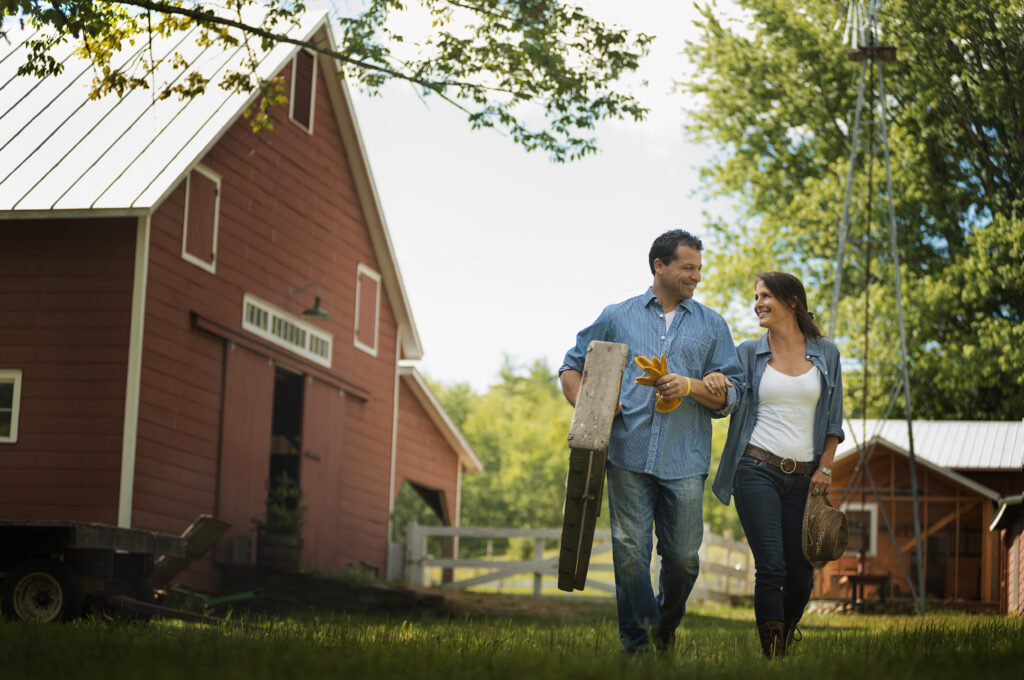 A couple is working together at the barn on their farm in Ohio